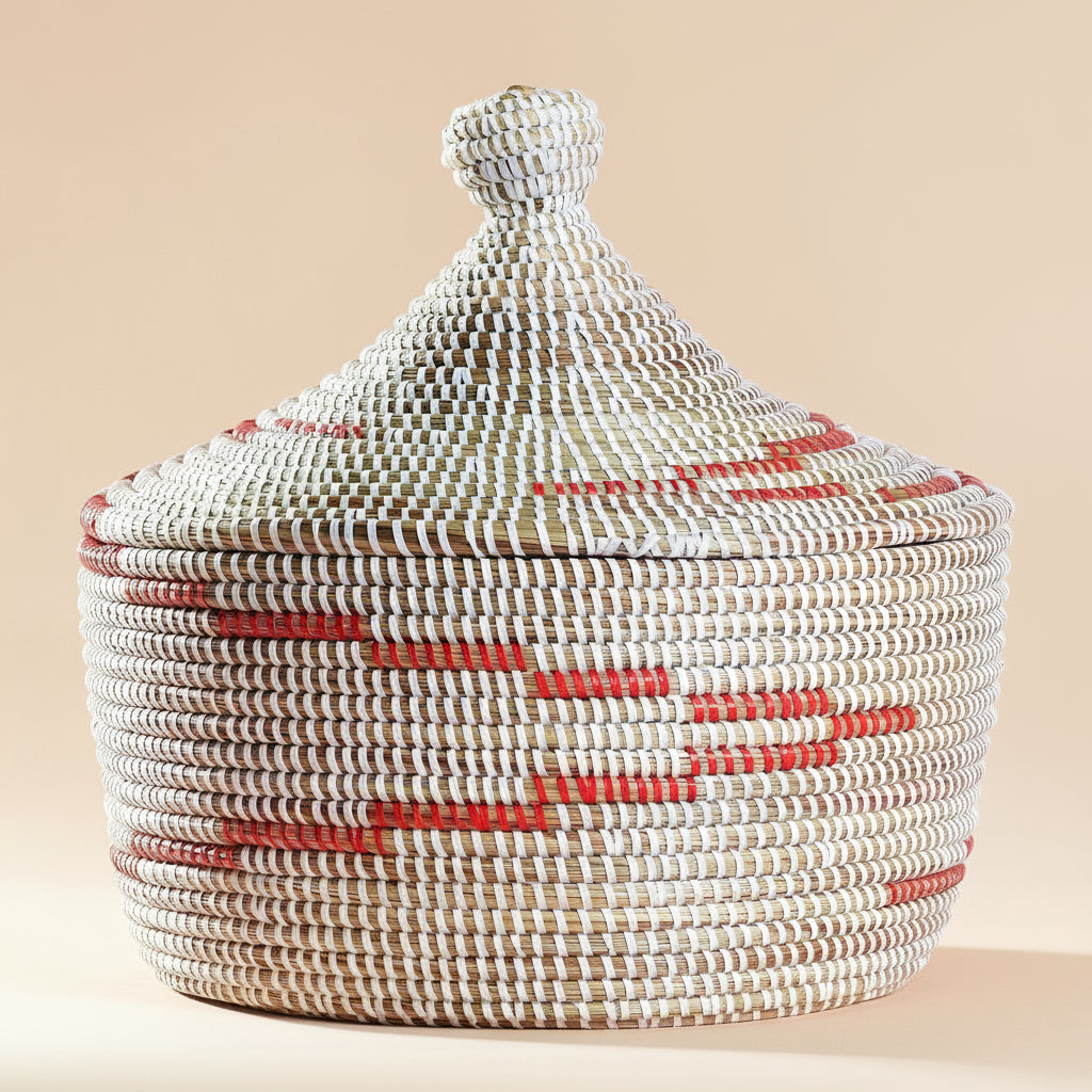 Woven basket with a lid on a pink background